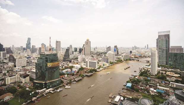 Buildings and the Chao Phraya River in Bangkok. A slump in real yields on US Treasury bonds is set to stoke demand for Asian government debt as the search for income forces investors to take on more risk.