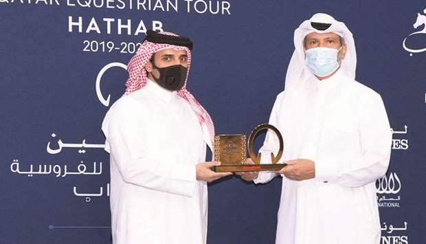 Bader al-Darwish, Organising Committee Member u2013 Longines Hathab, and Secretary-General of Qatar Equestrian Federation, honours main partners of the 2019-2020 Longines Hathab Qatar Equestrian Tour u2014 Saleh al-Mana, Vice-President Government and Public Affairs, ExxonMobil Qatar Limited, and AbdulSalam Abu-Issa, Chief Executive Officer, Salam International.