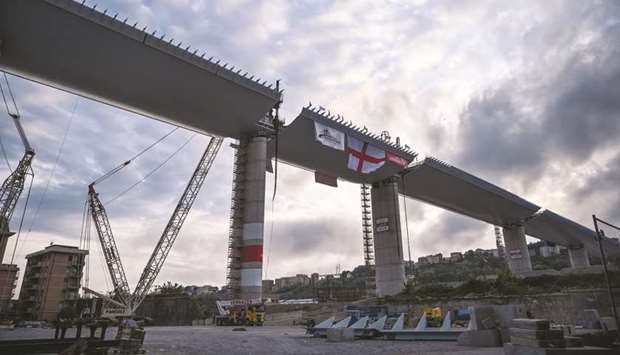 This file photo taken on April 27, shows the last 44m span that is being hoisted between columns 10 and 11 on the bridgeu2019s eastern side in Genoa.