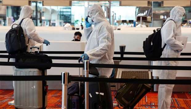 Seafarers who have spent the past months working onboard vessels arrive at the Changi Airport in Singapore 
