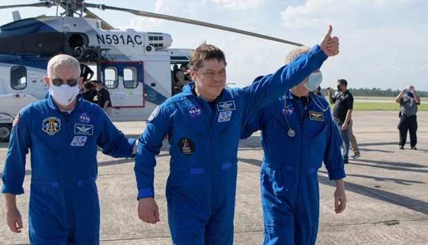 NASA astronaut Robert Behnken giving a thumbs up to onlookers as he boards a plane at Naval Air Station Pensacola to return him and NASA astronaut Douglas Hurley home to Houston a few hours after the duo landed in their SpaceX Crew Dragon Endeavour spacecraft off the coast of Pensacola, Florida on August 2. AFP/NASA/BILL INGALLS/HANDOUT