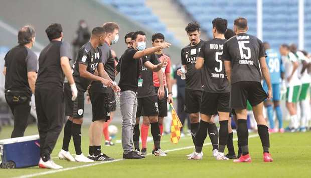 Al Sadd coach Xavi Hernandez gives instructions to his players during the QNB Stars League match against Al Ahli at the Al Janoub Stadium yesterday.