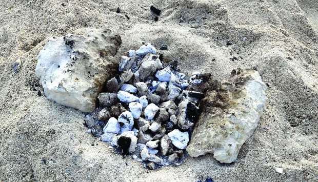 Barbecue remains on the Al Wakra family beach. PICTURE: Ram Chandrnrn
