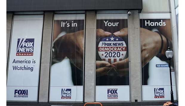SPOT:LIGHT: A political display is posted on the outside of the  Fox News headquarters on 6th Avenue in New York in July.