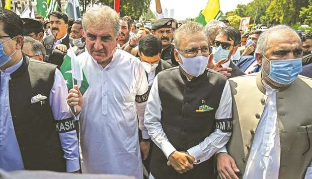 President Arif Alvi (second right), Foreign Minister Shah Mehmood Qureshi (second left) and Speaker of the National Assembly Asad Qaiser (right) are seen leading a rally in Islamabad to show their solidarity with people of Indian-administered Kashmir.