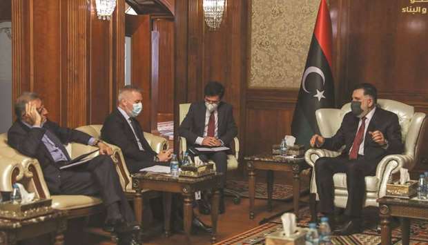 Prime Minister of Libyau2019s UN-recognised Government of National Accord Fayez al-Sarraj meets with Italian Minister of Defence Lorenzo Guerrini (second left) in the capital Tripoli, yesterday.