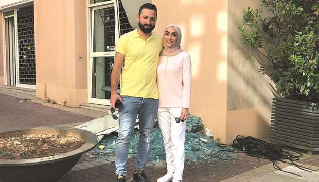 Bride Israa Seblani poses for a picture with her husband Ahmad Subeih in the same place where they were taking their wedding photos, at the moment of the explosion that occurred at Beirutu2019s port area, yesterday.