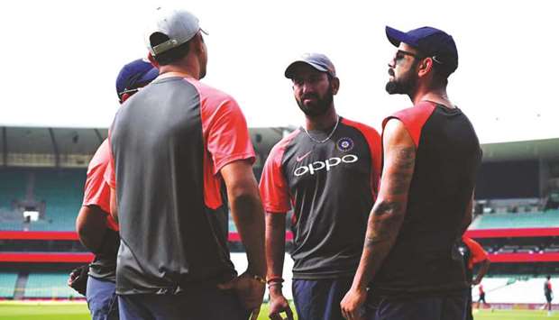 In this January 2, 2019, picture, India captain Virat Kohli (right) and teammate Cheteshwar Pujara attend a training session in Sydney. (AFP)