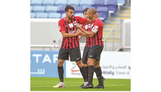 Al Rayyan captain Yacine Brahimi (right) celebrates with teammates after scoring against Al Sailiya during the QNB Stars League match yesterday.