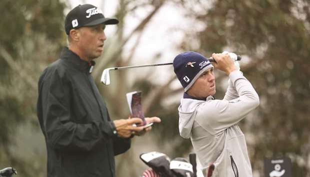 Justin Thomas of the United States hits a tee shot as his caddie, Jim u201cBonesu201d Mackay looks on during a practice round prior to the 2020 PGA Championship at TPC Harding Park in San Francisco, California, yesterday. (Getty Images/AFP)