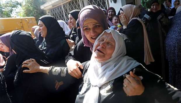 Relatives of Palestinian woman Dalia Smoudi mourn during her funeral in Jenin in the Israeli-occupied West Bank, Reuters