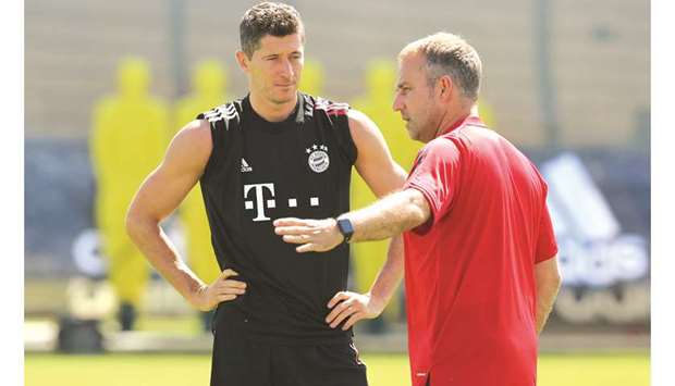 Bayern Munich coach Hansi Flick (right) talks to forward Robert Lewandowski during training in Munich. (Reuters)