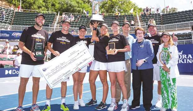 Billie Jean King (third from right) with New York Empireu2019s Jack Sock, Neal Skupski, Nicole Melichar, Kim Clijsters and Colleen Vandeweghe celebrate with the trophy after  winning the World TeamTennis  tournament.