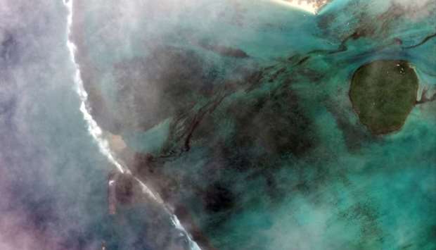 A satellite image shows the bulk carrier ship MV Wakashio and its oil spill after it ran aground off the southeast coast of Mauritius. Satellite image 2020 Maxar Technologies/via REUTERS.