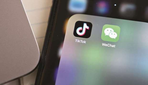 The Tencent Holdings WeChat and ByteDance TikTok app icons are displayed on a smartphone in Arlington, Virginia. In announcing the bans u2014 to take effect in 45 days u2014 Trump declared on Thursday that Chinese mobile apps u201cthreaten the national security, foreign policy, and economy of the United States.u201d