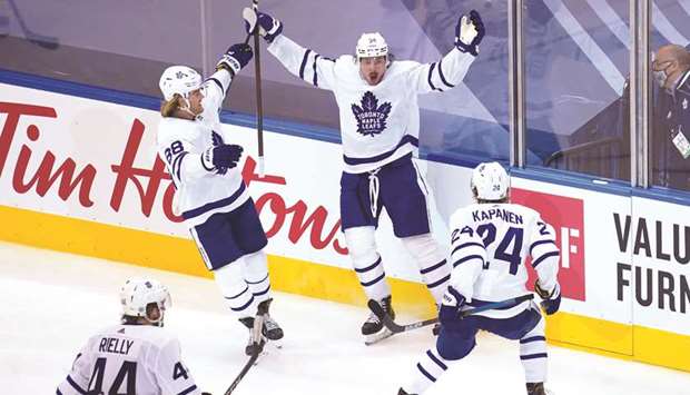 Toronto Maple Leafsu2019 Auston Matthews (right) celebrates his game-winning goal against the Columbus Blue Jackets at Scotiabank Arena in Toronto, Canada, on Friday. (USA TODAY Sports)