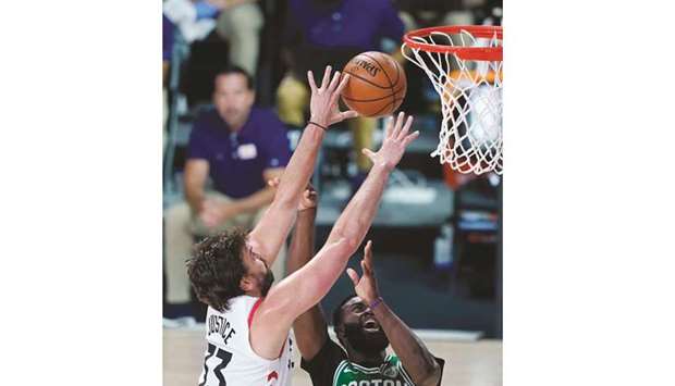 Toronto Raptorsu2019 Marc Gasol (left) and Boston Celticsu2019 Jaylen Brown compete for a rebound during the NBA game at The Arena at Lake Buena Vista in Florida, United States, on Friday. (USA TODAY Sports)