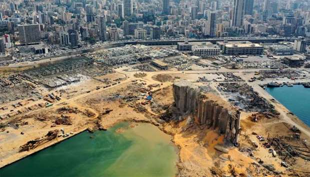 An aerial view shows a partial view of the port of Beirut, the damaged grain silo and the crater caused by the colossal explosion