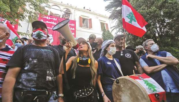 Lebanese protesters are pictured inside the Ministry of Foreign Affairs in Beirut yesterday, after protesters stormed the ministry as anger exploded over a deadly blast that made hundreds of thousands homeless and shocked the world.