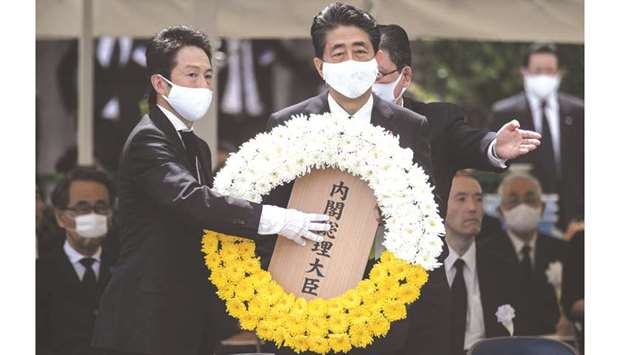Japanese Prime Minister Shinzo Abe lays a wreath during a ceremony marking the 75th anniversary of the atomic bombing of Nagasaki, at the Nagasaki Peace Park yesterday.