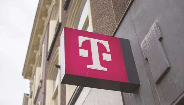 The T-Mobile logo outside a mobile phone store, operated by Deutsche Telekom, in Utrecht, Netherlands. Reliance Industries is weighing a bid for Deutsche Telekomu2019s Netherlands subsidiary, according to people familiar with the matter.