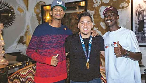 Mutaz Barshim (also below) poses with Qatar national football team player Almoez Ali (right) during a homecoming celebration for the Olympic gold medallist earlier this week in Doha.