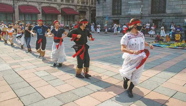 People perform an Aztec dance in Mexico Cityu2019s Zocalo Square.