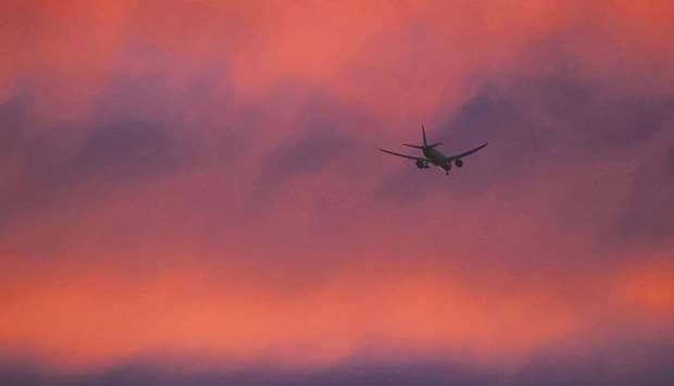 A plane flies in a red sky above London earlier this year. Neither airlines nor their biggest corporate customers are in a position to claim that their flights are u201ccarbon neutral.u201d