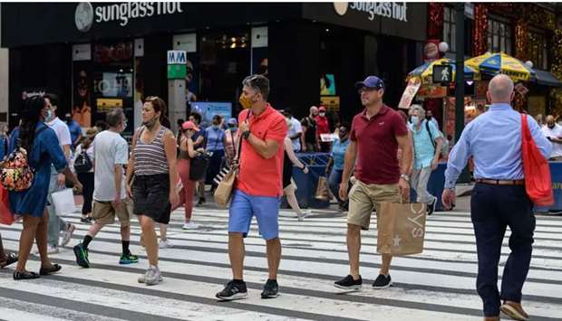 People walk through Herald Square on a warm day on June 7, 2021 in New York City. (AFP/Getty Images)