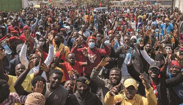 Supporters for Zambiau2019s presidential candidate for the opposition party United Party for National Development (UPND), Hakainde Hichilema, gather yesterday outside one of the party offices, where they are demanding the release of the full set of electoral results in Lusaka.