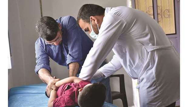 IDPs receiving health care services at Suluk Health Centre.