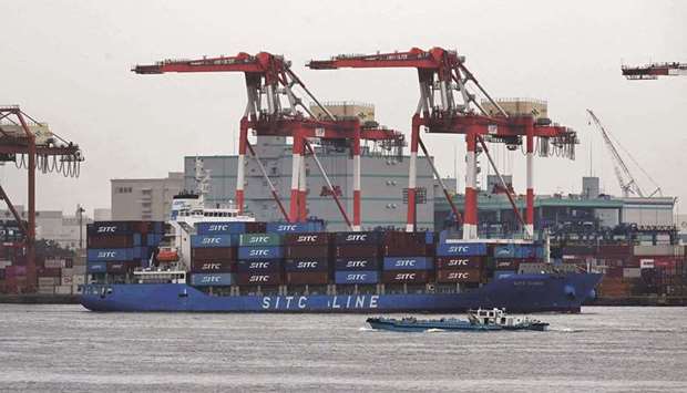 A cargo ship arrives at the international cargo terminal at the port of Tokyo. Japanu2019s economy grew slightly in the second quarter, recovering from a slowdown at the start of the year despite continuing virus surges and  restrictions, data showed yesterday.
