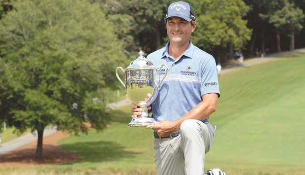 Kevin Kisner poses with the Sam Snead Cup after winning the Wyndham Championship at Greensboro in North Carolina, USA. (USA TODAY Sports)