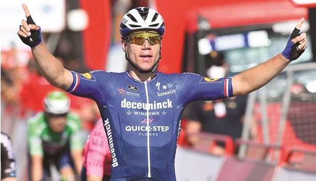 Team Deceuninck Quick Stepu2019s Dutch rider Fabio Jakobsen celebrates as he crosses the finish line to win the 4th stage of the 2021 La Vuelta yesterday. (AFP)