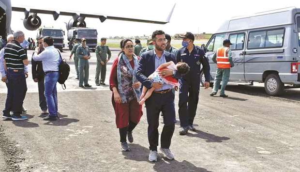 Indian civilians who were evacuated arrive in the western Indian city of Jamnagar for refuelling on the way to Delhi.