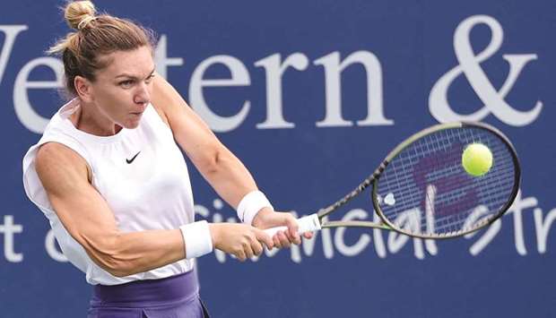 Simona Halep of Romania plays a backhand during her match against Magda Linette of Poland at the Western & Southern Open at Lindner Family Tennis Center in Mason. (Getty Images/AFP)