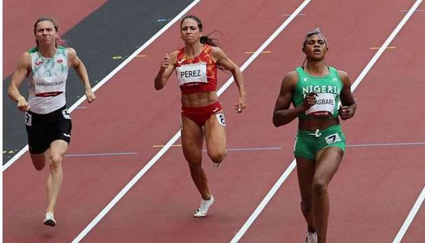 This file photo taken on July 30 shows (from L) Belarus' Krystsina Tsimanouskaya, Spain's Maria Isabel Perez and Nigeria's Blessing Okagbare competing in the women's 100m heats during the Tokyo 2020 Olympic Games at the Olympic Stadium in Tokyo. AFP