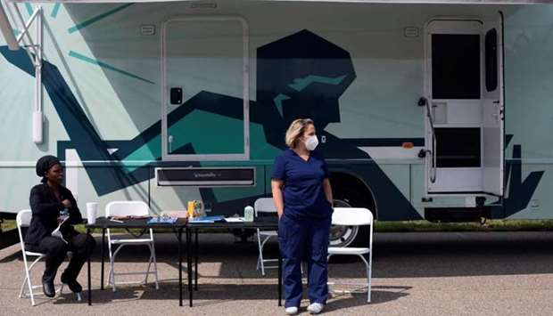 Nurses wait for people to come by to receive their coronavirus disease vaccine at a mobile pop-up vaccination clinic hosted by the Detroit Health Department with the Detroit Public Schools Community District at East English Village Preparatory Academy in Detroit, Michigan, US on July 21. REUTERS