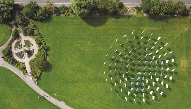 People visit Luke Jerramu2019s u201cIn Memoriamu201d, a temporary memorial artwork for all those who lost their lives due to Covid-19, in Seaton Carew Park, Hartlepool, Britain.