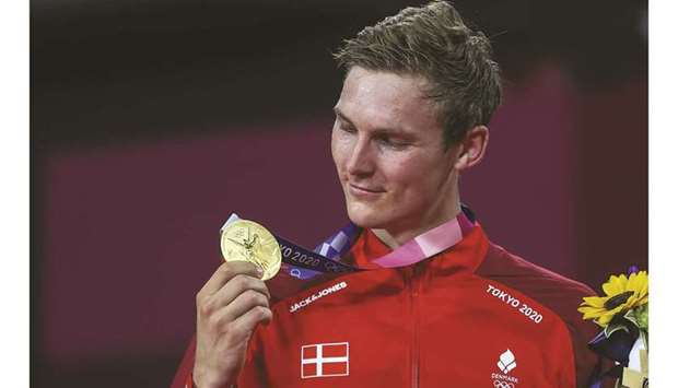 Gold-medallist Viktor Axelsen of Denmark looks at his medal at Musashino Forest Sport Plaza in Tokyo. (Reuters)