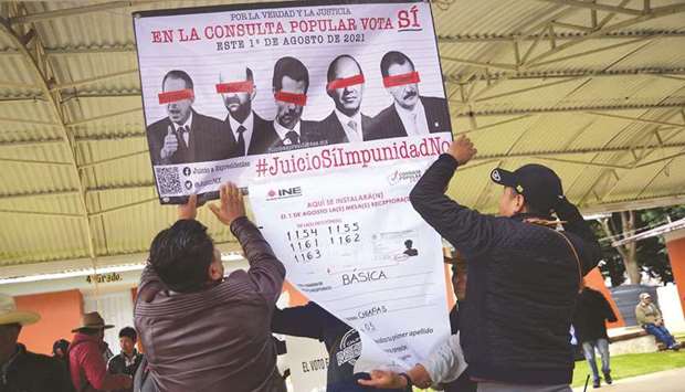 People from an indigenous community take part on Sunday in a referendum to decide whether to investigate five former leaders, at a polling station in Corazon de Maria, in Mexicou2019s Chiapas state.
