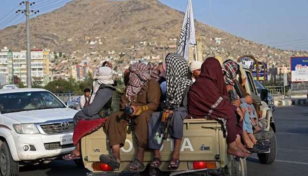 Taliban fighters in a vehicle patrol the streets of Kabul on August 23, 2021.