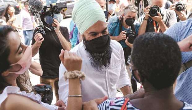 New Democratic Party leader Jagmeet Singh greets NDP candidate for Papineau Christine Pare (right) in Montreal, Quebec. The NDP leader visited several constituents and businesses in the Papineau riding. The area is known for being Liberal leader Justin Trudeauu2019s main riding.