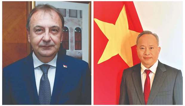 Serbian ambassador Jasminko Pozderac, left, and Vietnamese ambassador Tran Duc Hung