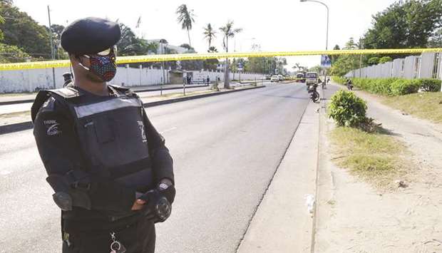 A Tanzanian security officer guards an entrance to the French embassy after an attacker wielding an assault rifle was killed in the Salenda area of Dar es Salaam, on Wednesday.