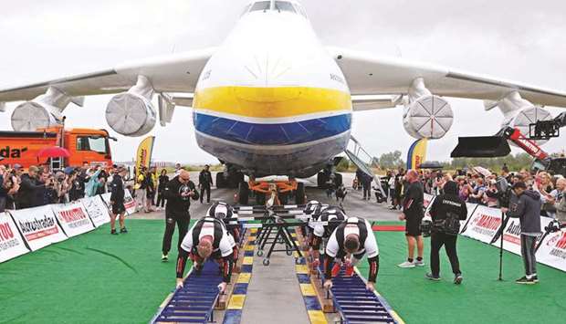 Ukrainian u2018strongmanu2019 athletes attempt to set a world record for pulling the worldu2019s largest cargo plane, the Antonov An-225 Mriya, at an airfield in the settlement of Hostomel outside Kyiv.