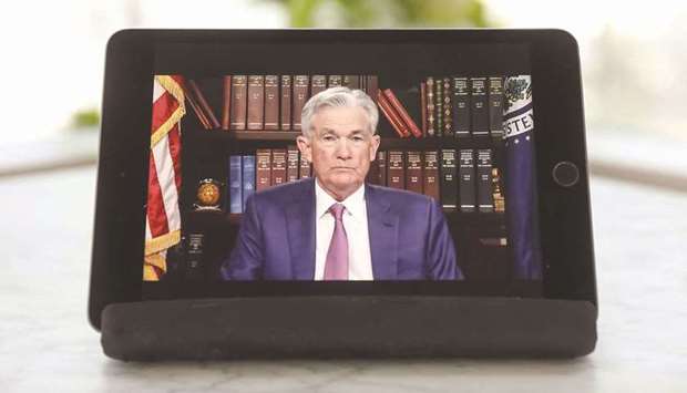 Jerome Powell, chairman of the US Federal Reserve, pauses while speaking virtually during the Jackson Hole economic symposium in Tiskilwa, Illinois, yesterday. Powell said the central bank could begin reducing its monthly bond purchases this year, though it wonu2019t be in a hurry to begin raising interest rates thereafter.