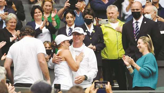 Australiau2019s Ashleigh Barty celebrates with coach Craig Tyzzer after winning her final match against Czech Republicu2019s Karolina Pliskova at the All England Lawn Tennis and Croquet Club in London on July 10, 2021. (Reuters)