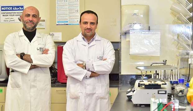 Dr Mohamed Elrayess and a researcher from the Biomedical Research Centre at QU.