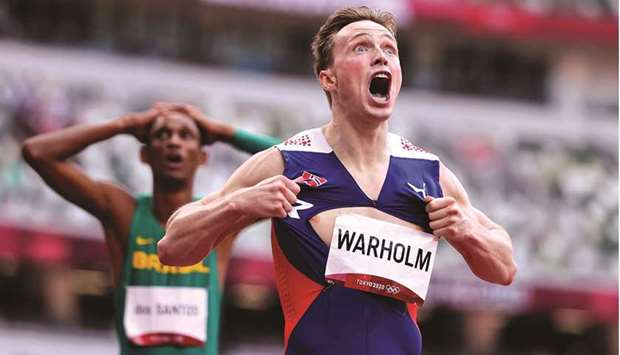 Karsten Warholm (also inset) of Norway celebrates after winning the menu2019s 400m hurdles gold in a world record time at the Tokyo Olympics yesterday. (Reuters)